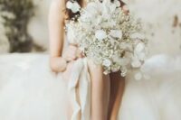 a lovely baby’s breath wedding bouquet