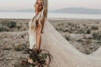 a beautiful blush A-line wedding dress with a train and a super long cape veil, with white stars embroidered is a gorgeous idea