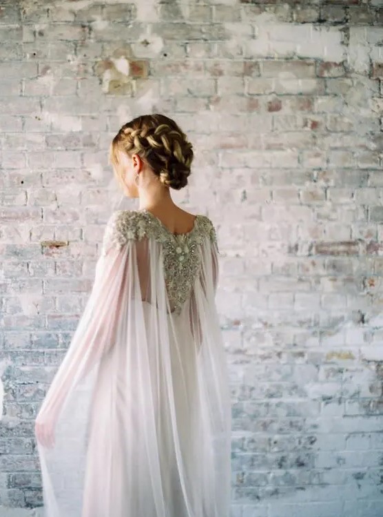 a chic flowy sheer wedding cape veil with heavy embellishments for a statement look