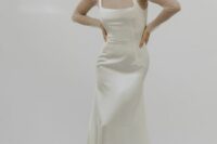 a chic silk wedding dress with a square neckline and straps plus a sheer turtleneck as a dress topper for a 90s inspired bridal look