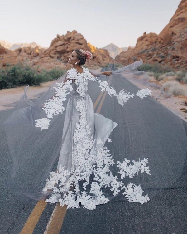 a fabulous sheer grey capelet with white lace is a fantastic statement for this simple bridal look