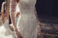 a jaw-dropping strapless beaded lace applique mermaid wedding dress paired with soft fingerless gloves that accent but don’t distract attention