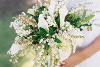 a lily of the vally wedding bouquet with greenery and calla lilies is a beautiful and creative idea of a spring wedding bouquet