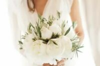 a lush white peony wedding bouquet with greenery is a great idea for a summer bride
