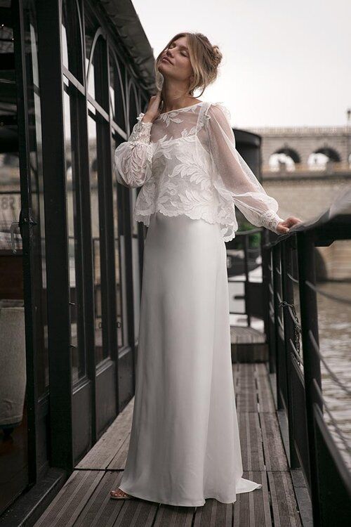 a minimalist plain slip wedding dress with a sheer and lace applique dress topper with long sleeves are a lovely combo