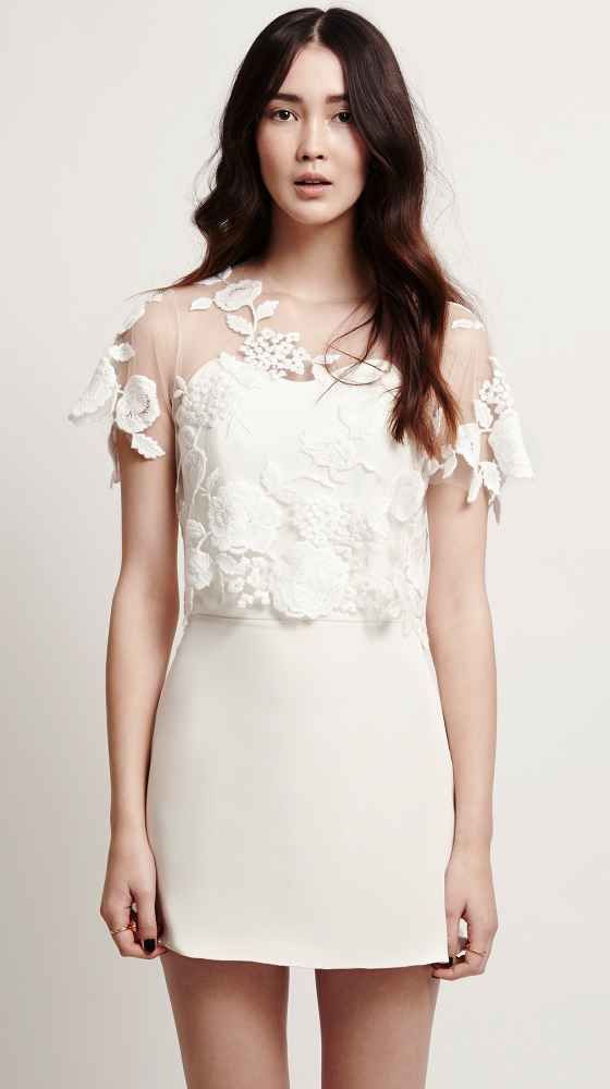 a modern plain short wedding dress accented with a sheer lace applique dress topper are a lovely combo for a wedding