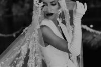 a retro bridal look with anA-line wedding dress, a floral veil and long gloves are a fantastic combo for a refined bride