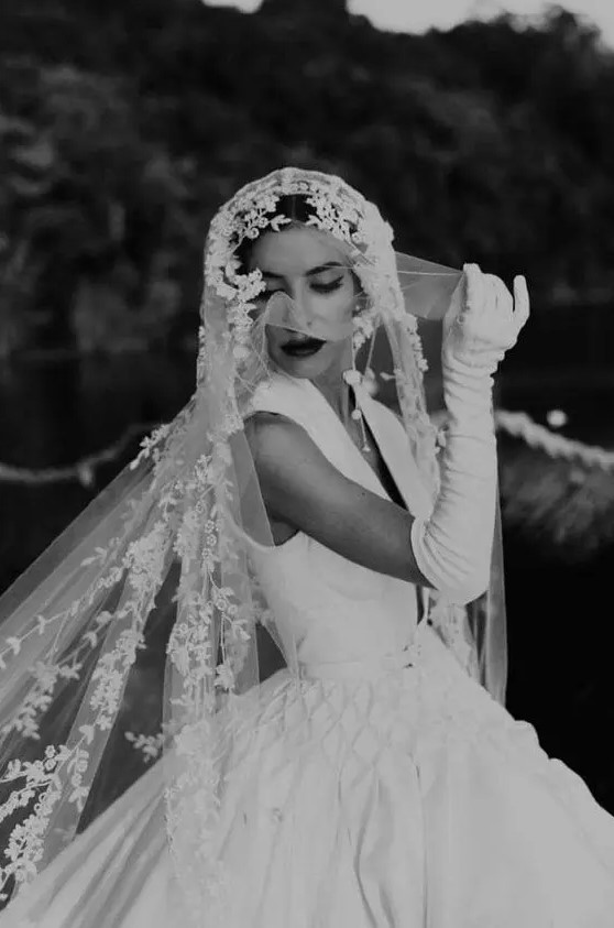 a retro bridal look with anA-line wedding dress, a floral veil and long gloves are a fantastic combo for a refined bride