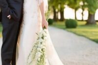 a romantic bridal look finished with a long stem white delphinium wedding bouquet is a gorgeous idea for a spring or summer bride