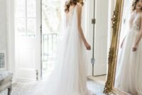 a sheer bridal cape veil with a long train is a gorgeous addition to any refined bridal look