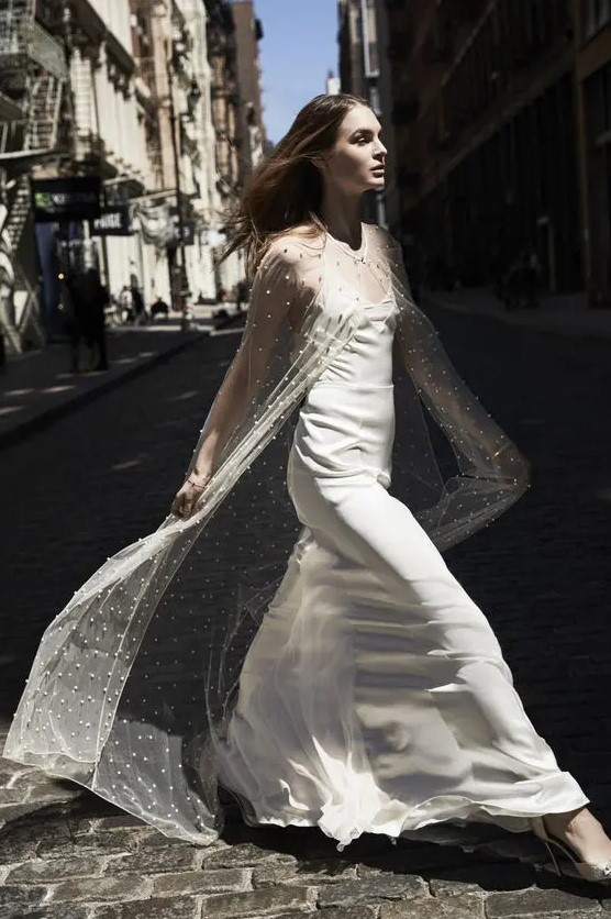 a sheer maxi bridal capelet with pearls is a beautiful solution to pair up with a plain wedding dress