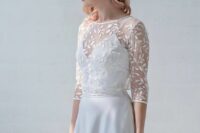 a silk spaghetti strap V-neckline wedding dress accented with a leaf applique dress topper with long sleeves for a catchy look
