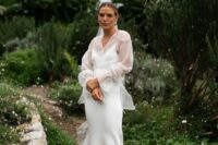 a silk spaghetti strap slip wedding dress with a sheer wrap dress topper with long sleeves for a more refined look