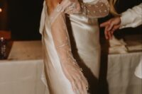 fantastic sheer tulle pearl wedding gloves are a nice match for a silk wedding dress, they will highlight its sophistication