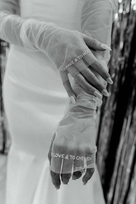 long fingerless sheer gloves with embroidered phrases are an amazing accessory for a modern bridal look