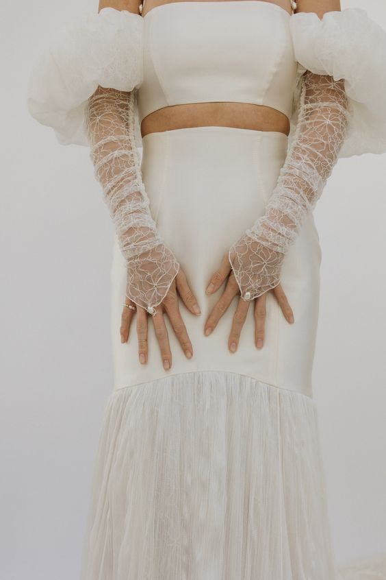 sheer fingerless embroidered wedding gloves with floral patterns and pearls are amazing as an accessory for this wedding look