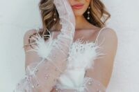 sheer tulle wedding gloves decorated with pink and white crystals will catch an eye and add glam to your look