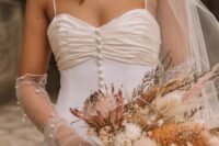 sheer tulle wedding gloves with pears echo with the necklace and earrings and add interest to the outfit