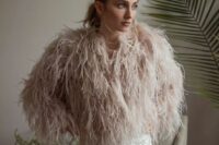 03 a blush feather bridal jacket will ad da delicate touch of color to the look and will make it fashion-forward