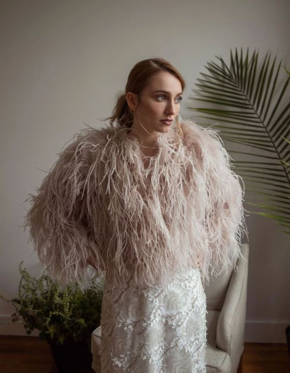 a blush feather bridal jacket will ad da delicate touch of color to the look and will make it fashion-forward