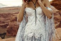 04 a blue printed corset off the shoulder wedding dress with white lace on the bodice and long fringe plus a hat for a boho feel