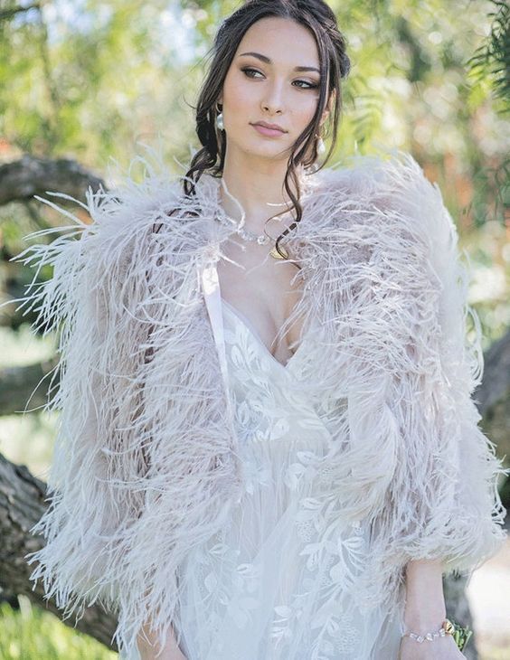 a blush ostrich feather bridal cover up will beautifully pair up with your wedding dress adding a subtle touch of color