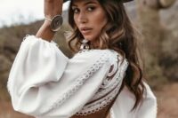 05 a boho bridal look with a boho fitting plain and lace wedding dress wiht a cutout back, a black leather hat with decor and some more accessories