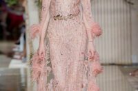 05 a bold pink sheer embellished wedding dress paired with a matching sheer embellished feather capelet create a royal look