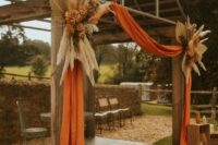 a lovely fall wedding arch