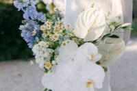 08 a catchy modern wedding bouquet of white chamomiles, orchids, blue blooms and white anthurium is a gorgeous idea