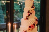 10 a white textural wedding cake decorated with bold flower spirals is a very chic and cool idea for a summer or fall wedding