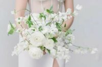 12 a gorgeous all-white wedding bouquet with blooming branches and greenery is a chic idea for a spring or summer bride