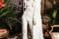 12 a jaw-dropping bridal look with a lace applique jumpsuit and a feather cover up with a train for a fashion-forward bride