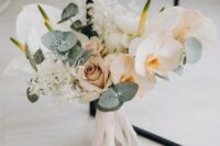 14 a lovely modern wedding bouquet of peachy and mauve roses and orchids, dried leaves and eucalyptus, anthurium is a chic idea