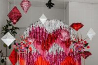 16 a super bold wedding backdrop of silver, pink and red tinsel streamers and matching colorful blooms and pinatas