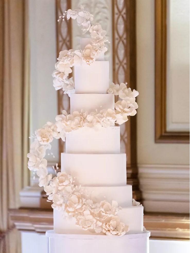 a large white square wedding cake with spiral white sugar blooms is a gorgeous idea for a refined modern wedding