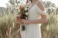 19 a neutral cold shoulder draped wedding dress with a V-neckline for a Grecian bride