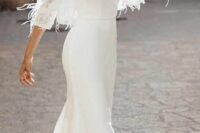 20 a plain mermaid wedding dress with a V-neckline, a train and a feather cropped wedding jacket with short sleeves