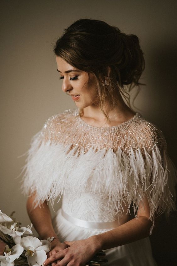 a small and chic embellished and feather cover up will instantly elevate your bridal look and make it sophisticated