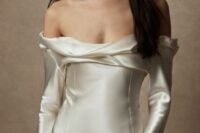 23 a silk off the shoulder wedding dress with a draped neckline and long sleeves is a dreamy and chic idea for a modern bride