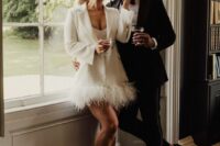 23 a strapless mini wedding dress, a white feather hem blazer and white ankle strap shoes for creating a modern bridal look