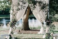 25 a neutral wedding backdrop with greenery is a lovely idea for outdoors, it looks beautiful and romantic
