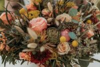 26 a western wedding bouquet of pink and blush blooms, billy balls, greenery, thistles and succulents is a jaw-dropping idea
