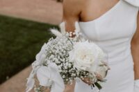 27 a modern white wedding bouquet of orchids, baby’s breath, bunny tails and roses is a gorgeous idea for a refined bride