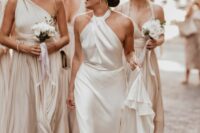 27 an effortlessly chic plain wedding dress with a halter neckline, a draped bodice and a skirt with a train is pure chic