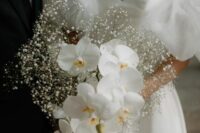 28 a modern wedding bouquet with baby’s breath and orchids is a lovely and cool idea for a modern refined bride