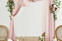 29 a refined wedding arch with pink, white and mauve drapes, greenery, white, pink and burgundy blooms, pillar and usual tall and thin candles
