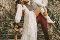 31 a chic western bridal look with a boho lace crop top with long sleeves, a high waisted skirt with a train, white cowboy boots and a neutral hat