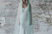 31 a mint blue bridal veil with feathers is a fantastic touch of color and a unique take on the traditional accessory