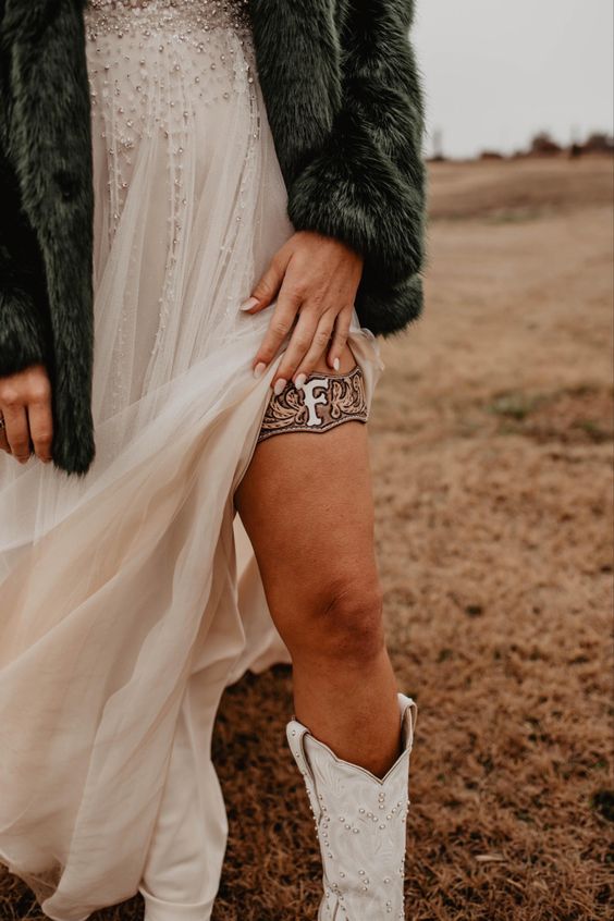 a leather monogram western bridal garter is a creative accessory, especially if you have a thigh high slit on your wedding dress